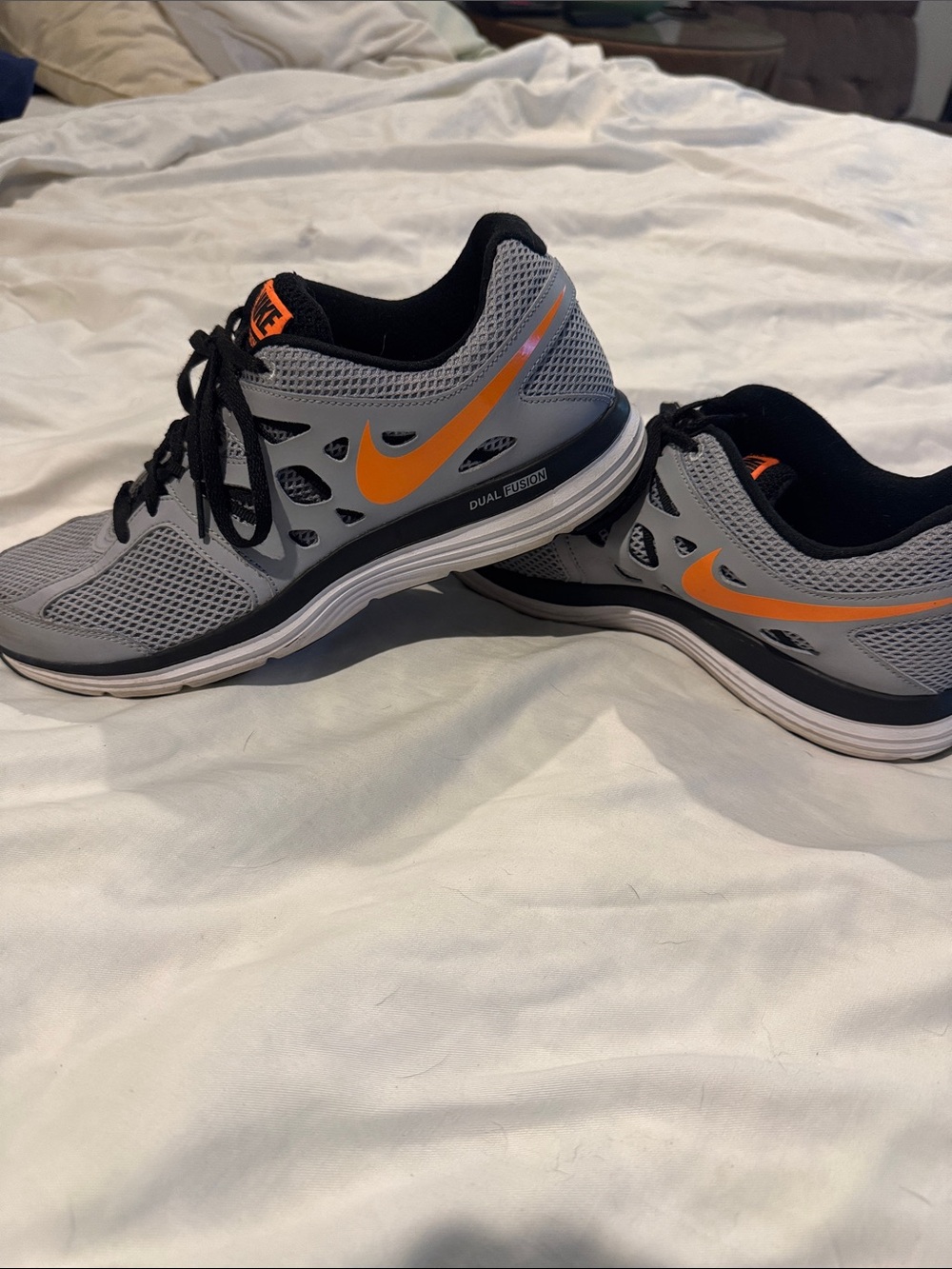 Nike Men’s Gray Athletic Running Shoes with Orange Swoosh